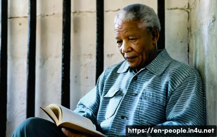 넬슨 만델라 남아프리카 공화국 - The Quiet Resolve of Robben Island**

"A realistic, cinematic photograph of Nelson Mandela in his 40...